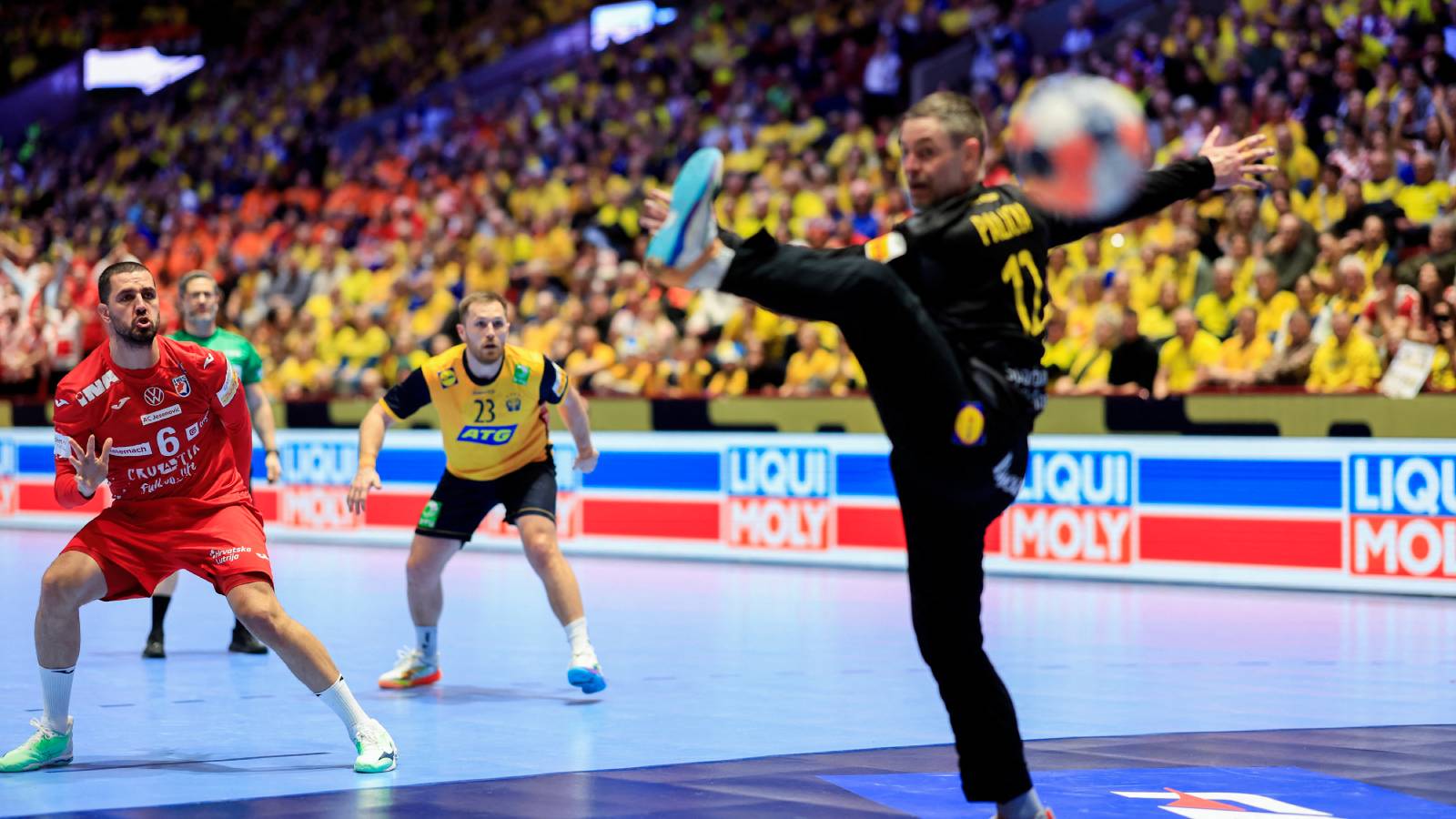 Croatia's right winger #06 Mario Sostaric (L) shoots a penalty during the men's EHF Euro 2026 Group E preliminary round handball match between Sweden and Croatia in Malmo, Sweden, on January 21, 2026.