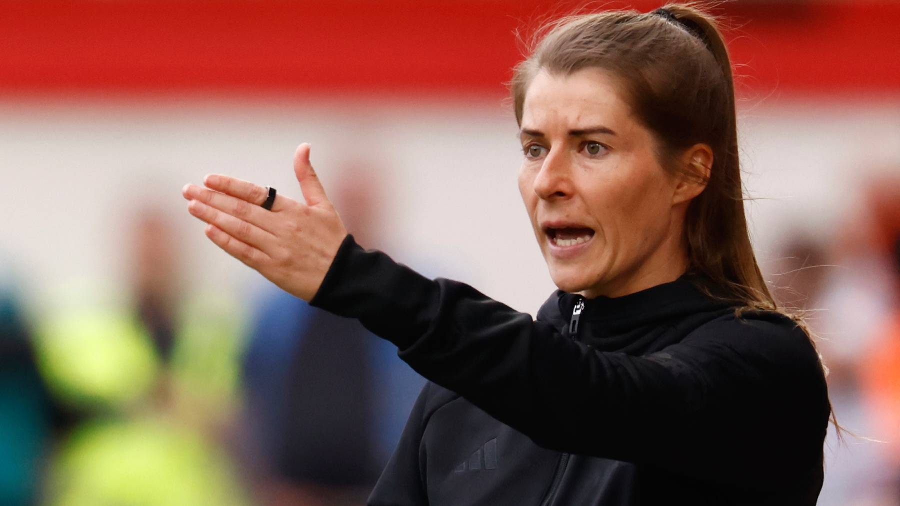 Union Berlin's German head coach Marie-Louise Eta gestures from the sidelines during the German first division Bundesliga football match between Union Berlin and VfL Wolfsburg in Berlin, Germany, on April 18, 2026.