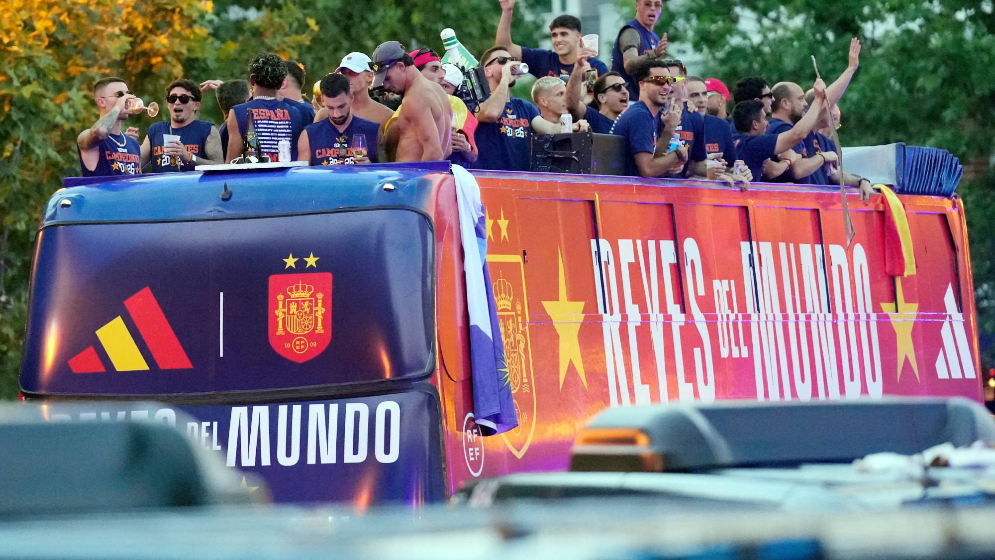 Spain's players parade onboard an open-top bus through the streets of Madrid on July 20, 2026, one day after the national football team won their second World Cup title following a 1-0 victory against Argentina. Spain's World Cup winners come back home to a heroes' welcome in Madrid, where a million fans are expected to greet them after a night of raucous celebrations across the country.