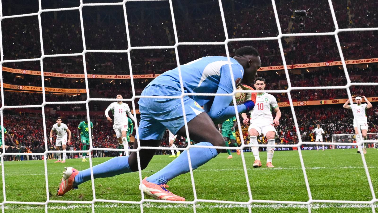 Morocco's forward #10 Brahim Diaz misses a penalty in front of Senegal's goalkeeper #16 Edouard Mendy during the Africa Cup of Nations (CAN) final football match between Senegal and Morocco at the Prince Moulay Abdellah Stadium in Rabat on January 18, 2026.